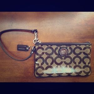 Large, brand new coach wristlet